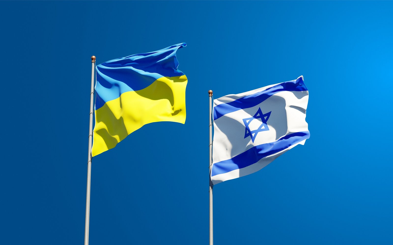 Beautiful national state flags of Ukraine and Israel together at the sky background. 3D artwork concept.